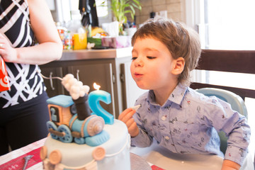 two years baby boy with birthday cake