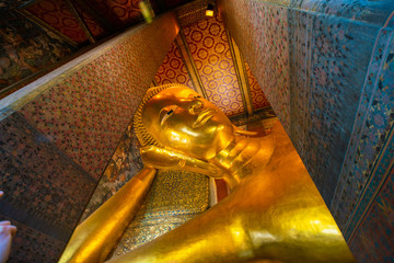Reclining golden buddha inside of pagoda Wat Pho