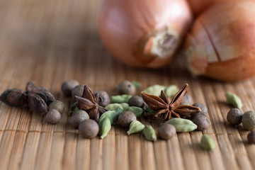 herbs and spices on wooden background