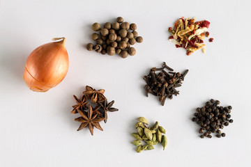 Star anise and cloves isolated on white.