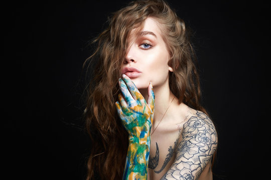 Sexy Girl with Tattoo and color paint on her Body.