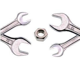 adjustable wrench and nut isolated on white background