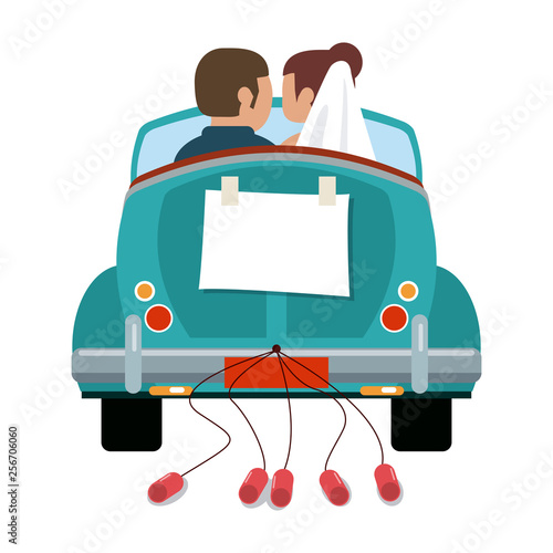 Wedding couple in vintage car with cans backward