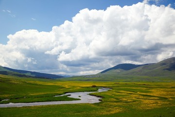 Sunny summer landscape with river.Green hills,fields and meadows