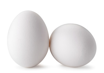 Two chicken eggs isolated on a white.