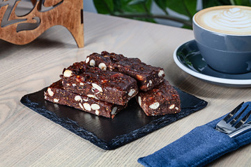 Close up view on fresh homemade Italian Christmas dessert panforte with nuts. Fresh sweet bakery with copy space. Sweet dessert for cooking book or recipe