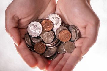 Fototapeta premium girls hands holding american cents coins 