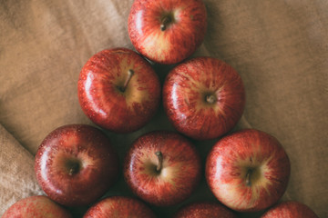 Ripe red apples piled as background. Top view of fresh apples. Organic fruit.   