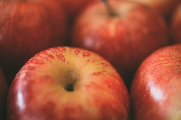 Macro view of red apples as background.