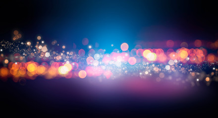 Dark background with multicolored bokeh, gradient and abstract bokeh light. Magic twinkling sparkles.