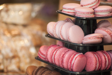 closeup of french macarons forming a pyramid in the bakery showroom