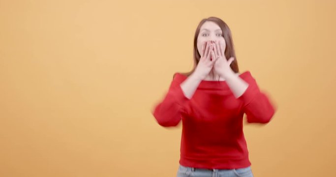 Beautiful cheerful young girl being very excited. Girl gets very excited after receiving great nes. jumps and laughs.