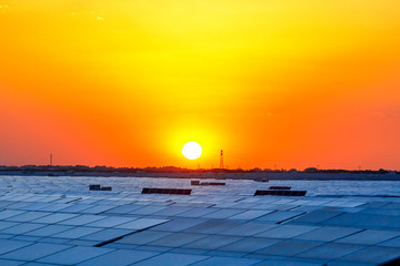 Solar photovoltaic panels under the glory of sunset