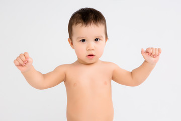 baby boy in diapers on white background, Infant baby boy in diaper crawl happily looking at camera isolated on white background, Infant baby boy in diapers standing on a white background