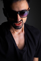 Obraz premium Dark guy with black glasses