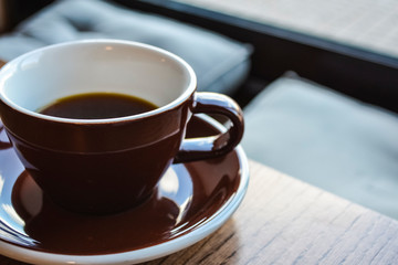 Alternative way of preparation of coffee. The invigorating morning strong drink in the server and a cup. Coffee shop. 