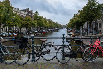 Fototapeta na wymiar Bicycles and canal in Amsterdam, the Netherlands