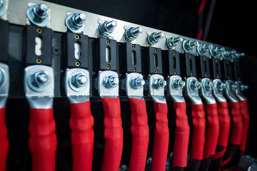 Close up of electrical connection with many cables and fuses