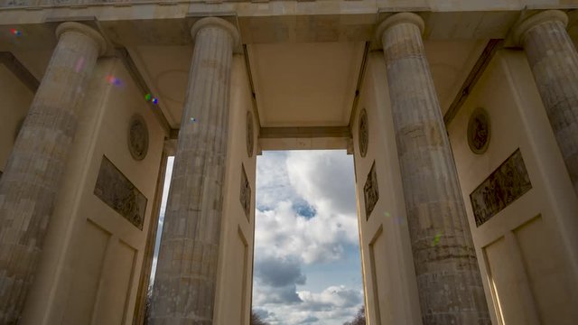 Time lapse. Brandenburg Gate or Brandenburger Tor in Berlin, Germany is a famous national landmark and tourist attraction at Unter den Linden, in the Mitte part of the German capitol City.
