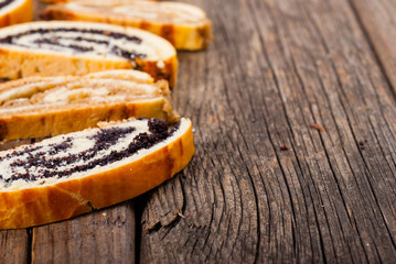 poppy and walnut roll cakes, old wood table, christmas and easter traditional east european dessert