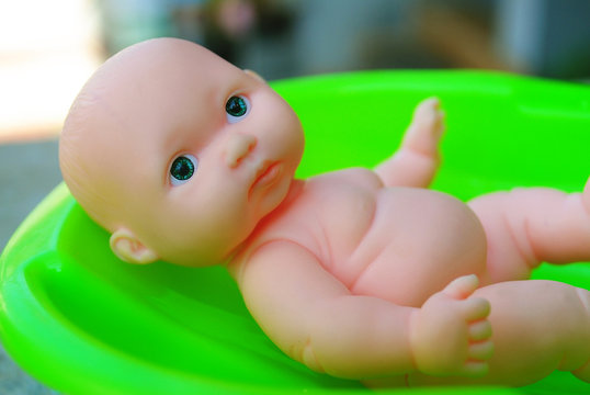 Baby toy is relax in bath tub. And enjoy sumar holiday