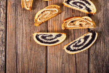 poppy and walnut roll cakes, old wood table, christmas and easter traditional east european dessert