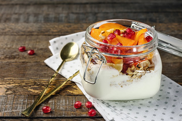 Yogurt with oats and fruits in a jar.
