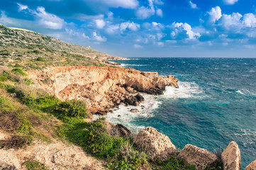 Ghar Lapsi Bay, Malta. Scenic coastline with rocky swimming cove and turquoise water