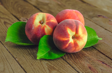 fresh peaches on wooden table