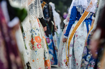 Naklejka premium Falleras dress traditional with flowers, Spain, Valencia. Fashion fallas festival in Valencia.