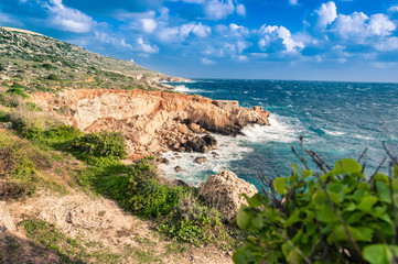 Ghar Lapsi Bay, Malta. Scenic coastline with rocky swimming cove and turquoise water