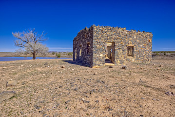 The ruins of a stone house built in the 1930s as part of a WPA Project intended to create Sullivan Lake. The project was abandoned when World War 2 broke out. Located in Paulden AZ.