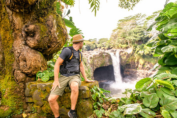 Naklejka na ściany i meble A man at The Rainbow Falls, Hilo, Wailuku River State Park, Big Island, Hawaii