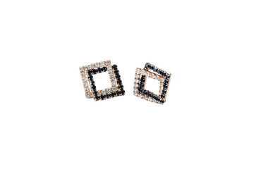 A pair of black diamond stud earrings on white