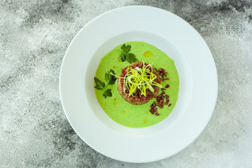 wild rice with meat and green sauce (main dish, portion). food background. copy space