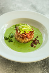 wild rice with meat and green sauce (main dish, portion). food background. copy space