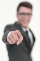 close up.modern businessman pointing at you