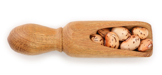 variegated kidney bean in wooden scoop isolated on white background. Top view. Flat lay