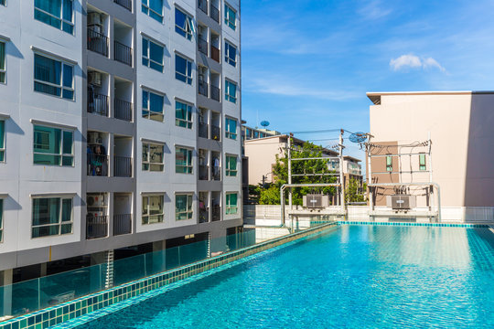 Low rise 8 floor modern condominium building with swimming pool