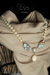 Pearl necklace hanging on the cloth