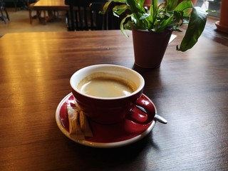 cup of coffee on wooden background