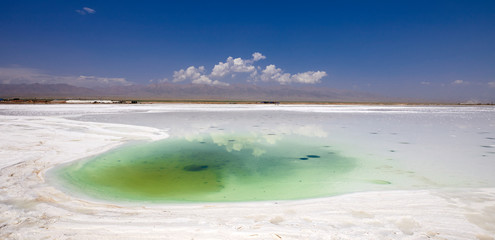 Salt lake under blue sky and white clouds