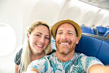 The Mid adult couple in economy class airliner