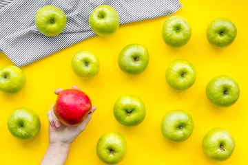 food pattern with green apples on yellow background top view