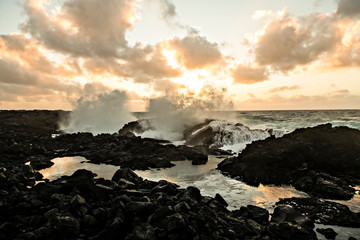 The Hawaiian sunset with big waves ocean