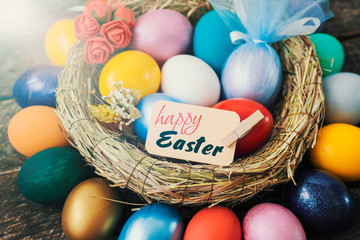 Easter colored eggs in egg nest, soft focus image. Happy Easter Card	