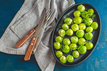 Brussels sprouts in served on black plate