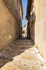 Beautiful typical French architecture in a narrow street in Arles, France
