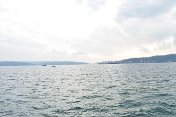 Obraz premium Sunset on the Bosphorus.ships passing through the Bosphorus.