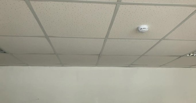 Armstrong ceiling in white room camera fly